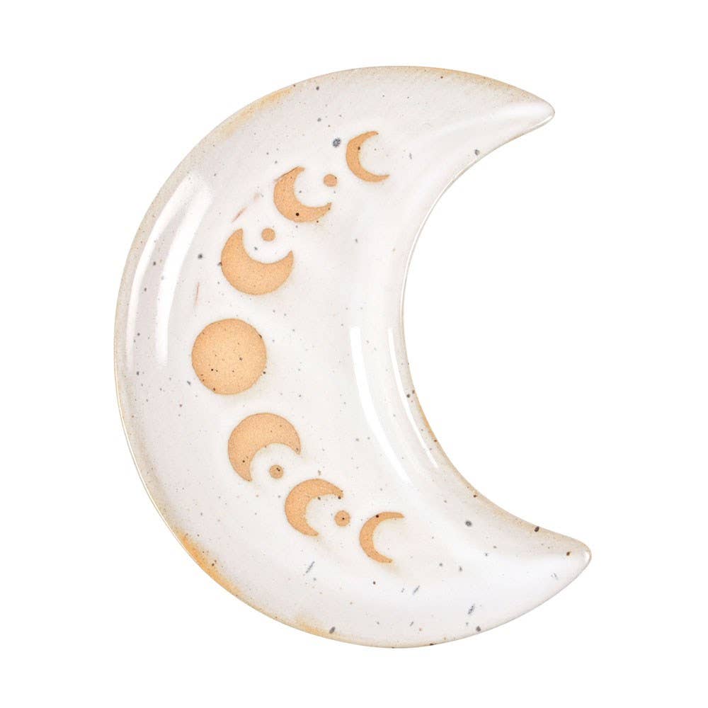 Ceramic moon-shaped decorative item with engraved symbols on a white background
