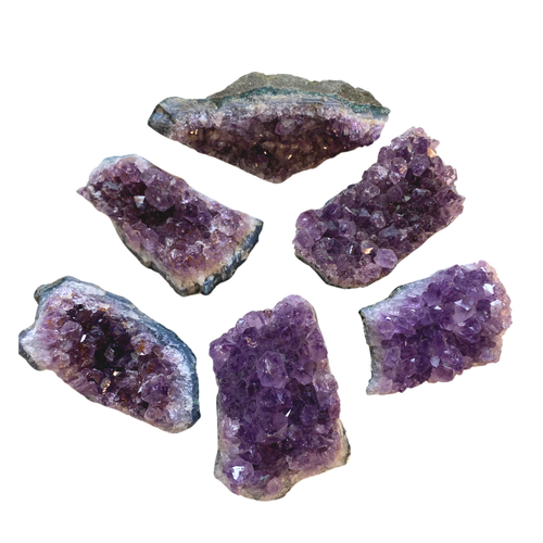 Amethyst Cluster depicted in various one of a kind formations. 