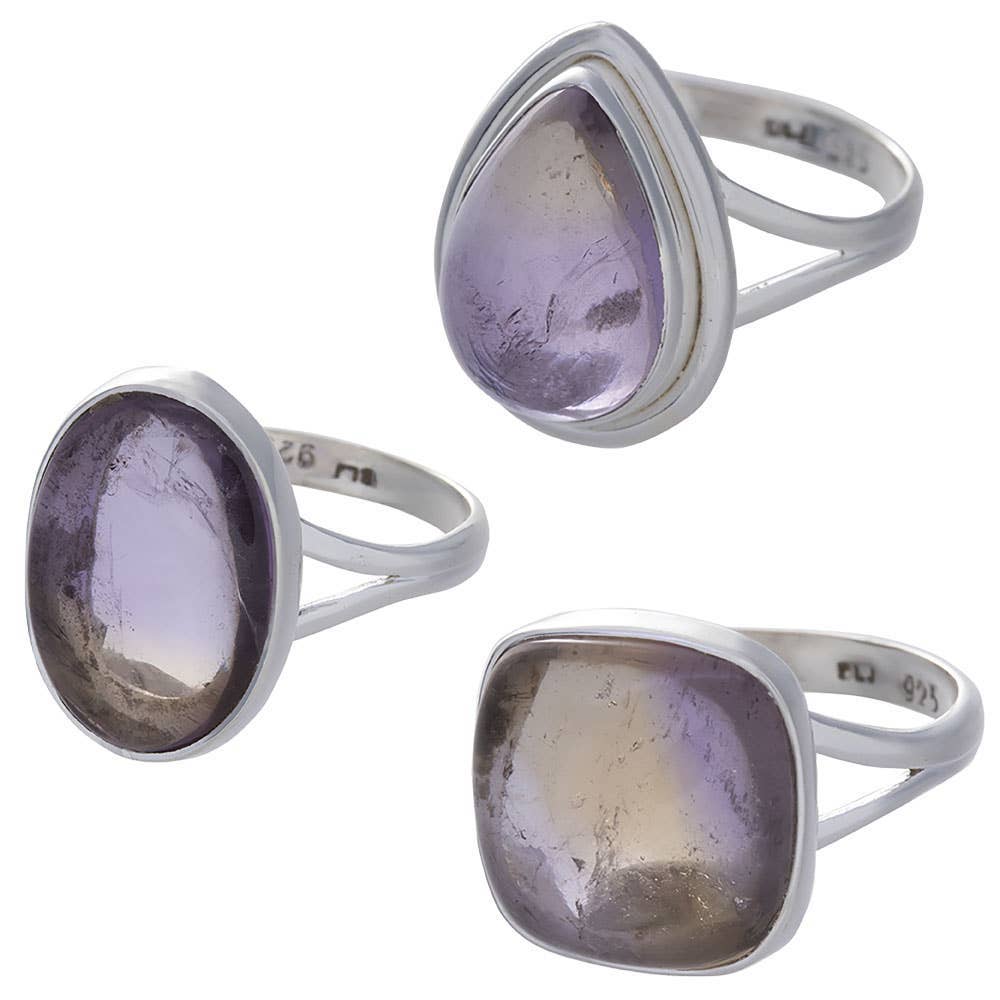 Three silver ametrine rings with purple gemstones on a white background