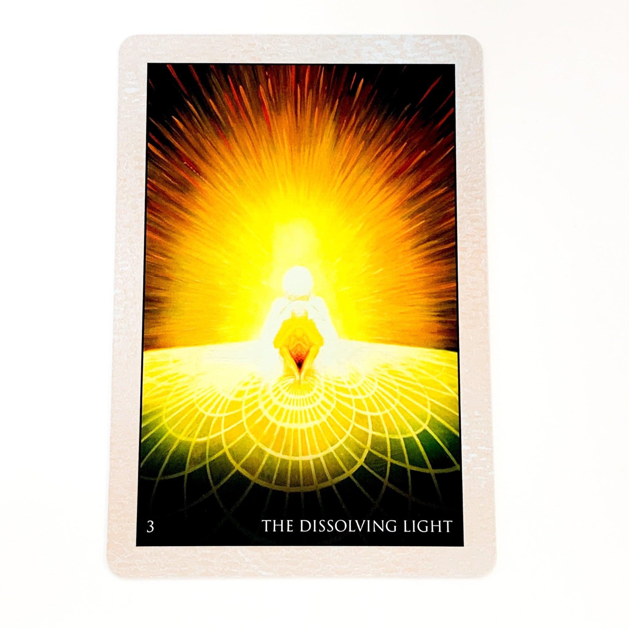 Tarot card titled 'The Dissolving Light' with a central figure and radiant light effect.