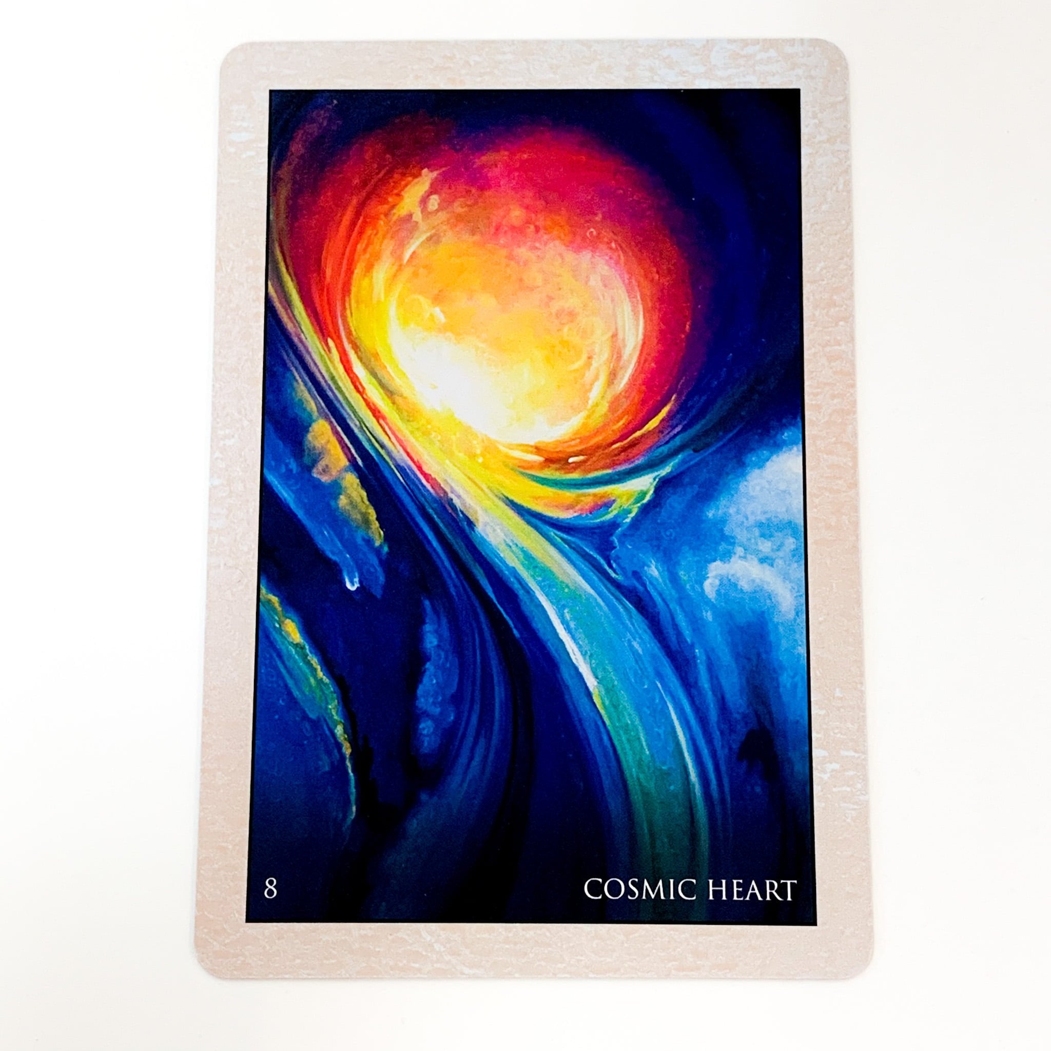 Card with a colorful cosmic design labeled 'Cosmic Heart' on a white background