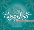 Front cover of the 'Rumi's Gift Oracle Cards' deck by Ari Honarvar, featuring a teal background with a central illustration of a woman's face surrounded by intricate calligraphic floral patterns and white text.