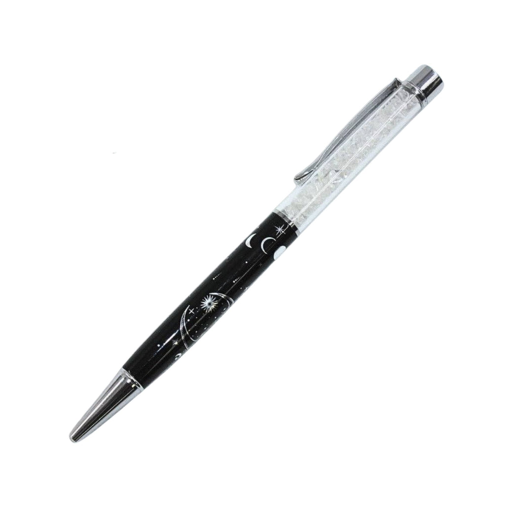 A black and silver ballpoint pen with a clear, glittery cap, featuring a celestial design of crescent moons and stars on the barrel.