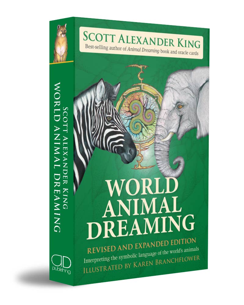 The book 'World Animal Dreaming' by Scott Alexander King, showing the front cover and spine. The cover is predominantly green with illustrations of a zebra, elephant, and a golden ornate object, with the title in large white text.
