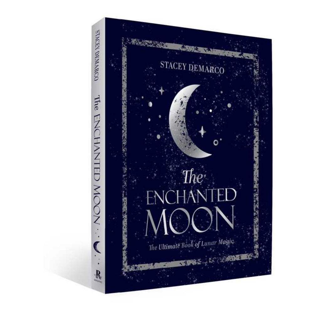 Book titled 'The Enchanted Moon' by Stacey DeMarco on a white background