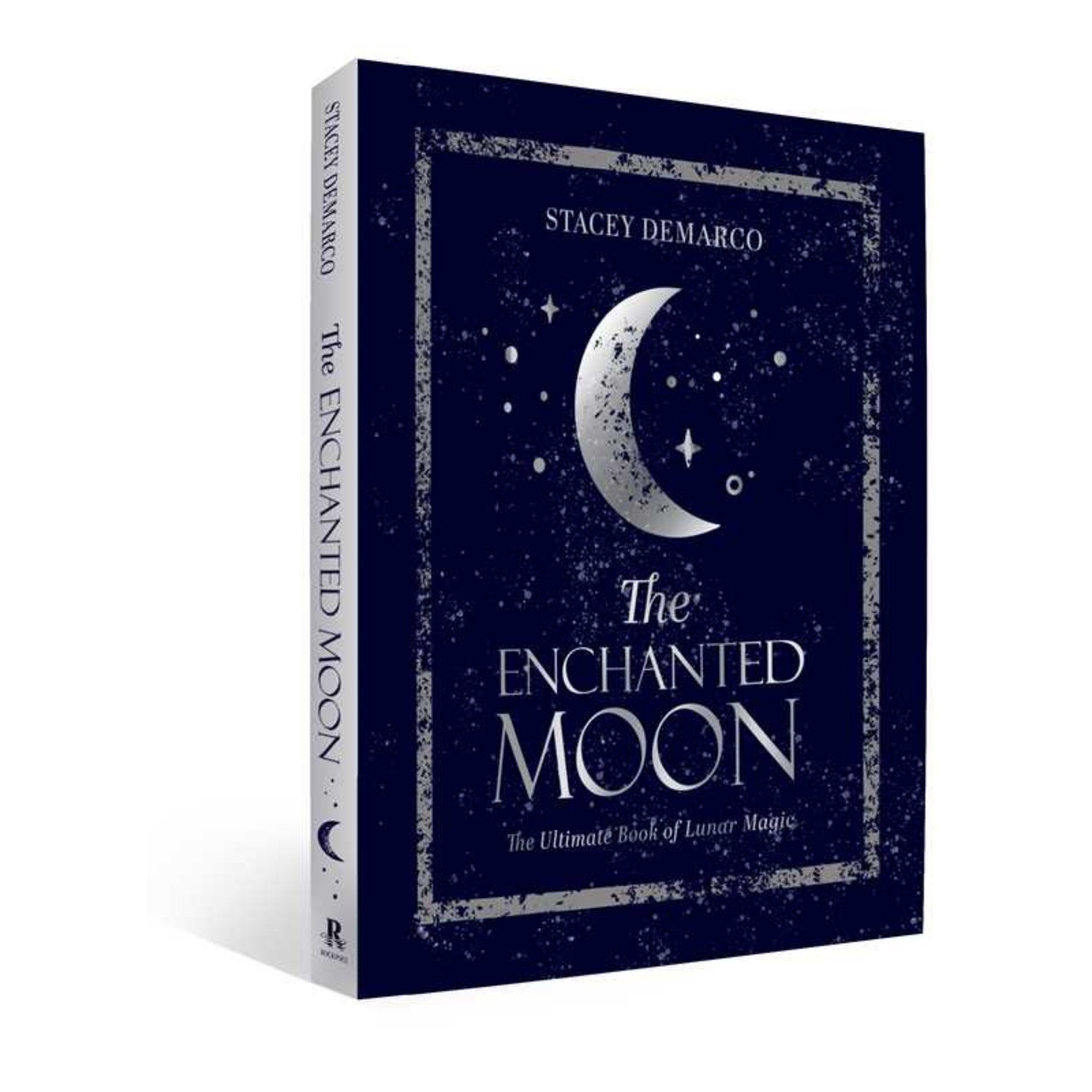 Book titled 'The Enchanted Moon' by Stacey DeMarco on a white background