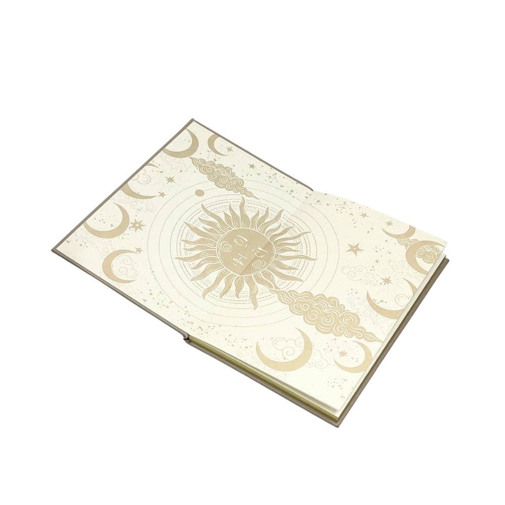 Decorative notebook with celestial design on a white background