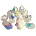 A group of natural crystal points with iridescent, rainbow-colored facets on a plain white background.