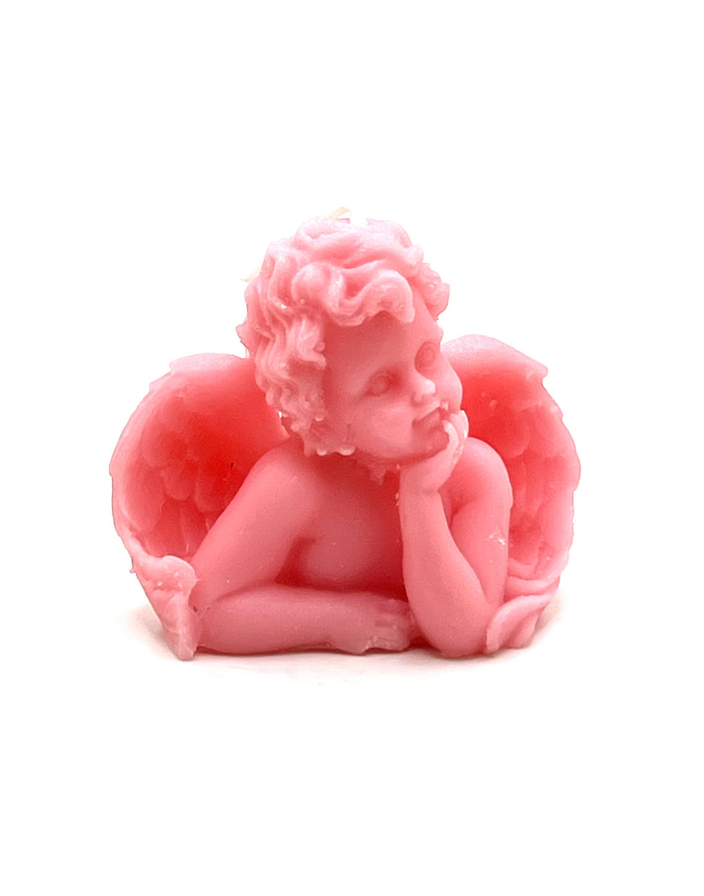 A pink cherub figurine with curly hair, angel wings, and a pensive pose, photographed against a plain white background.