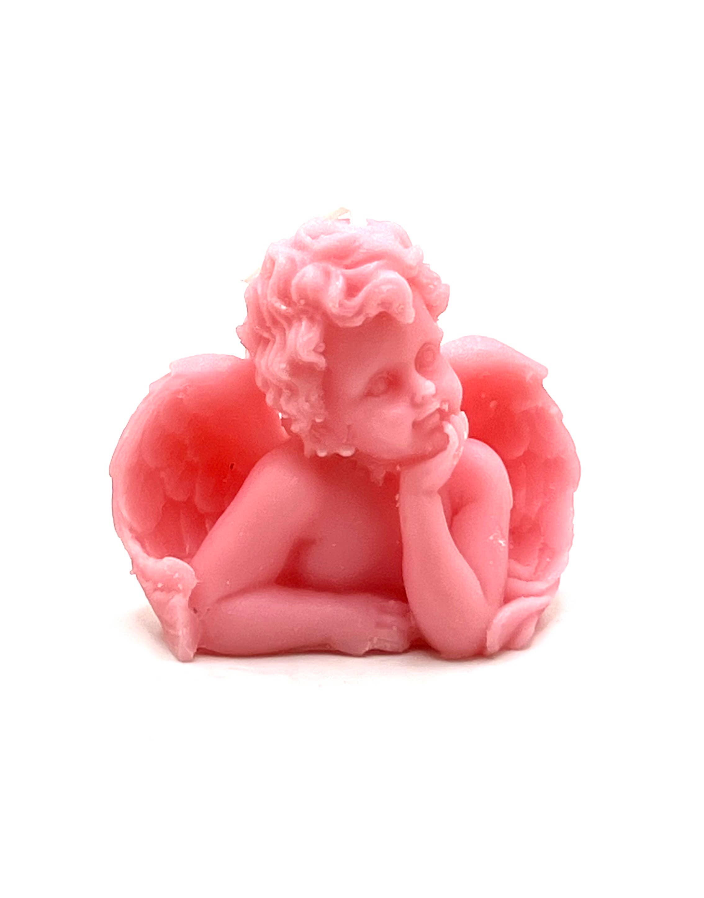 A pink cherub figurine with curly hair, angel wings, and a pensive pose, photographed against a plain white background.