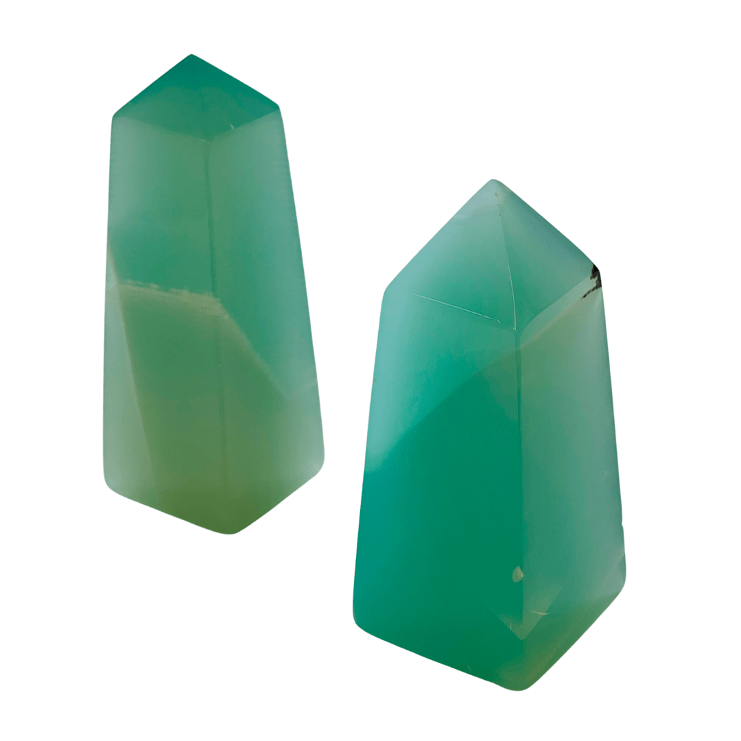 Two green geometric objects on a white background