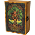 A wooden box featuring a detailed Celtic-style Tree of Life design on the front, with intricate knotwork borders, green foliage, and a brown tree trunk. The box has a hinged lid and a dark metal latch on the side.