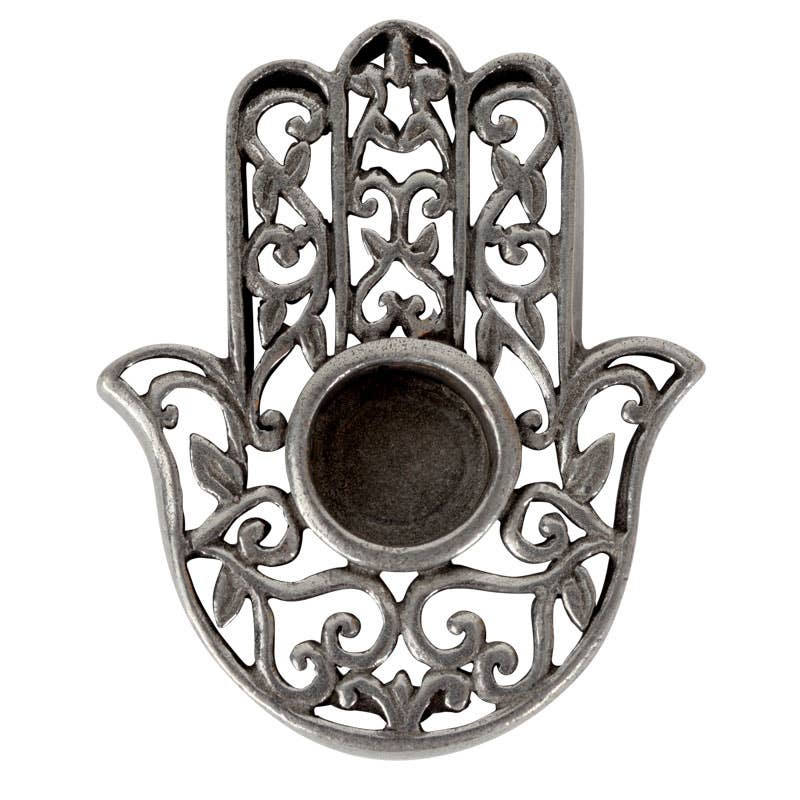 Decorative metal Hamsa hand mini candle holder with intricate designs on a white background