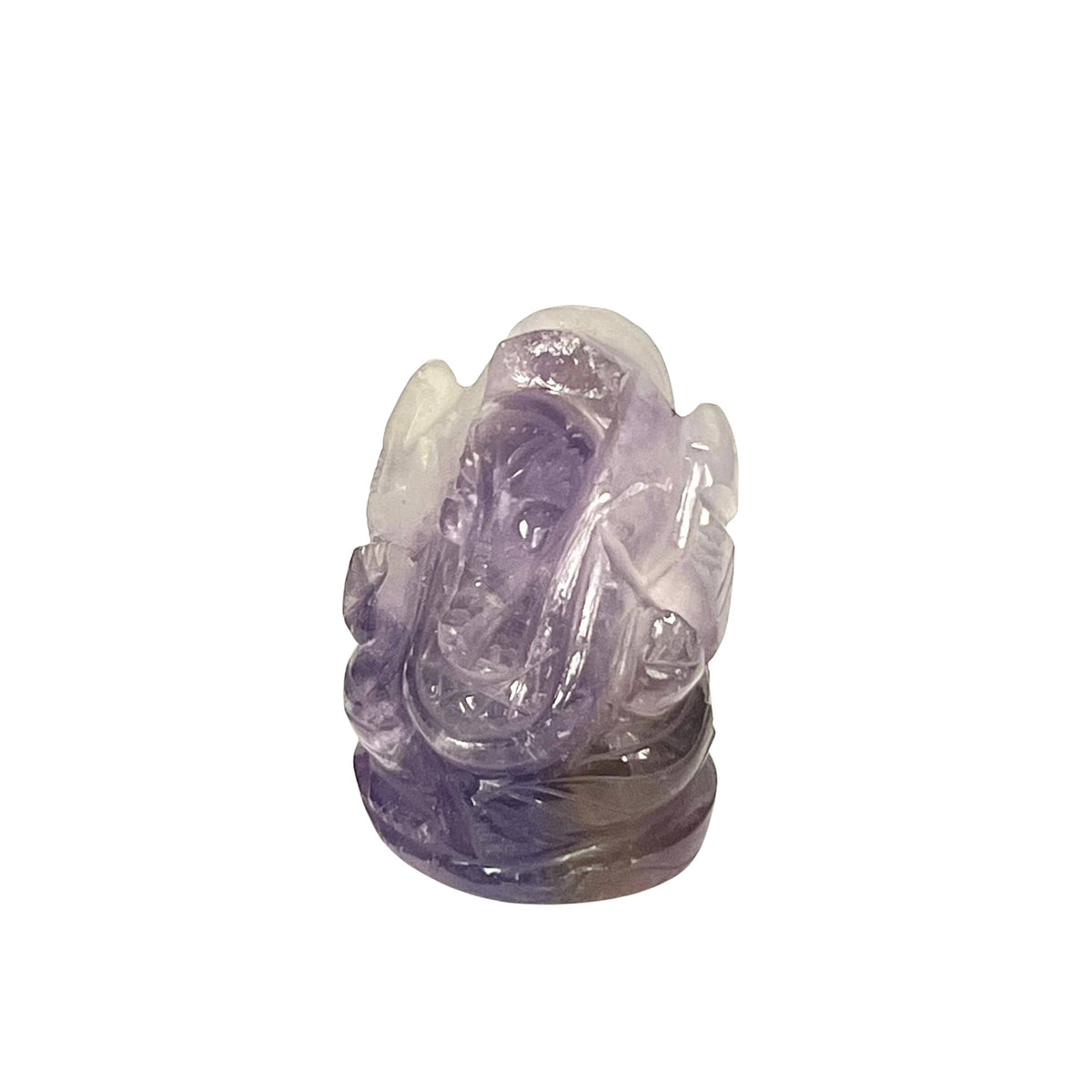 A carved amethyst figurine of a seated Buddha, showcasing a natural gradient from translucent light lavender to deep purple, set against a plain white background.