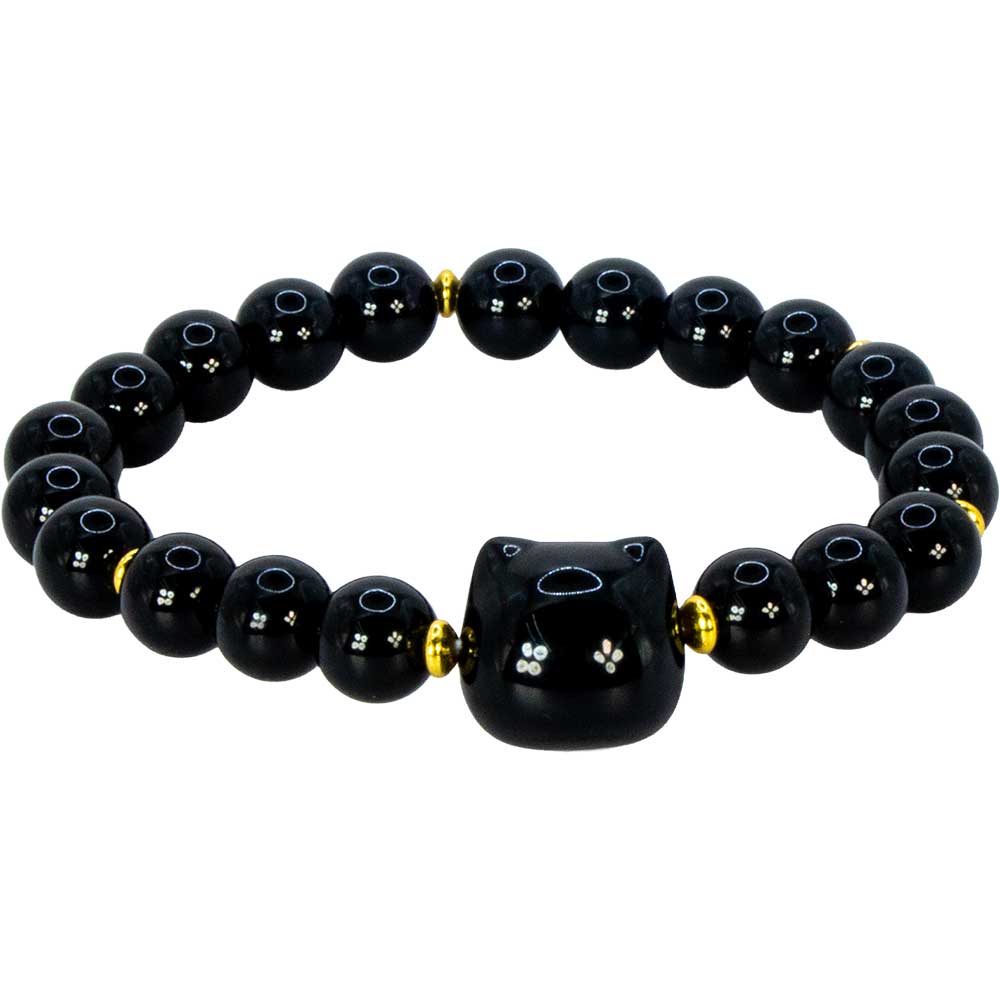 A black beaded bracelet featuring a central black cat-shaped bead with a hole, flanked by small gold spacer beads and round black beads with white star patterns.