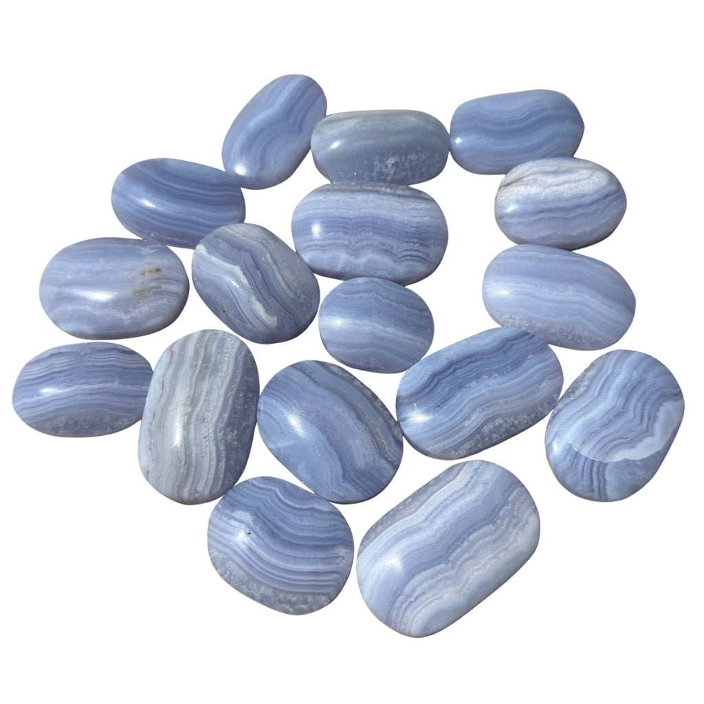 A group of polished blue agate tumbled stones with natural banding.
