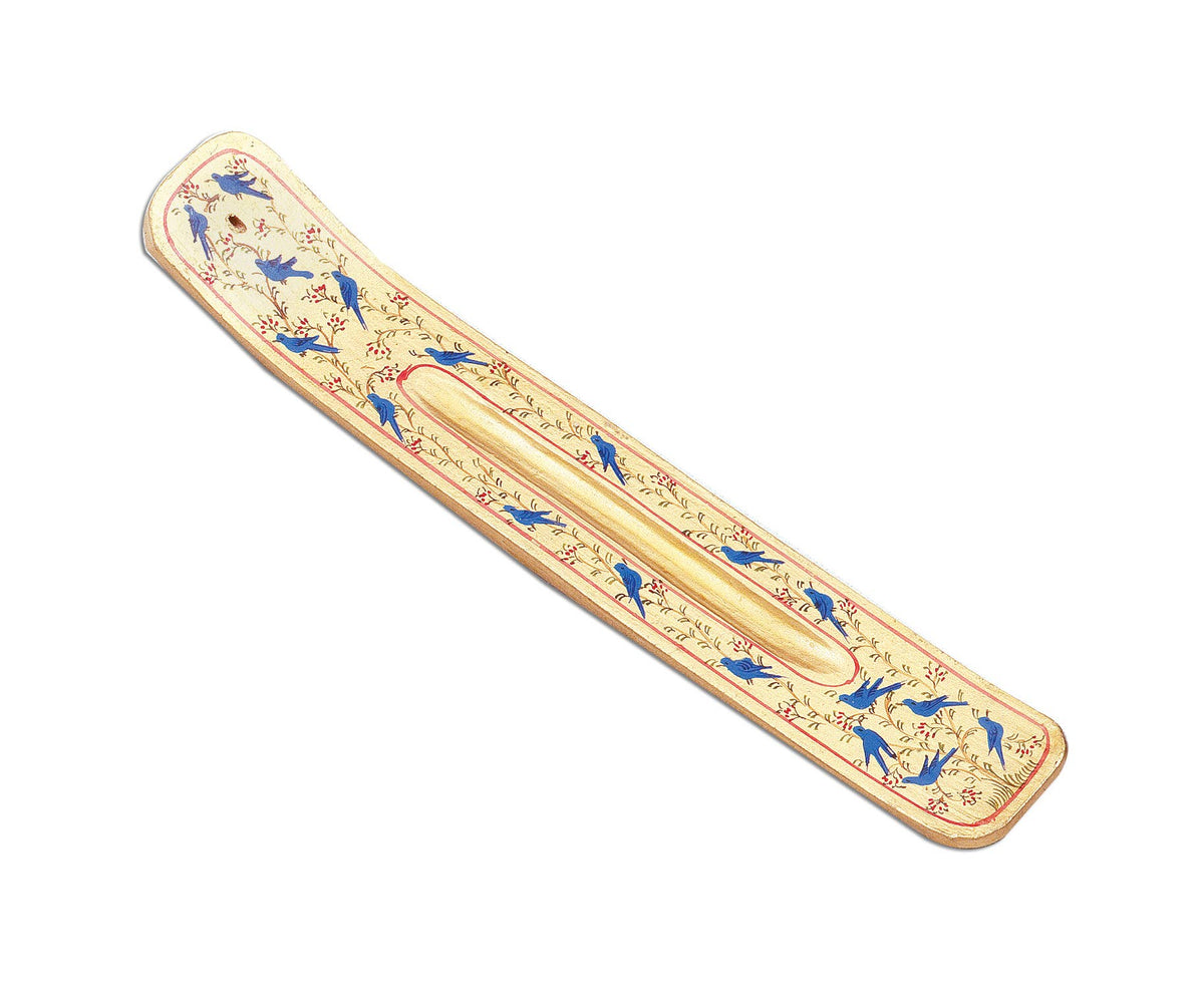 Decorative long incense holder with floral and bird patterns on a white background