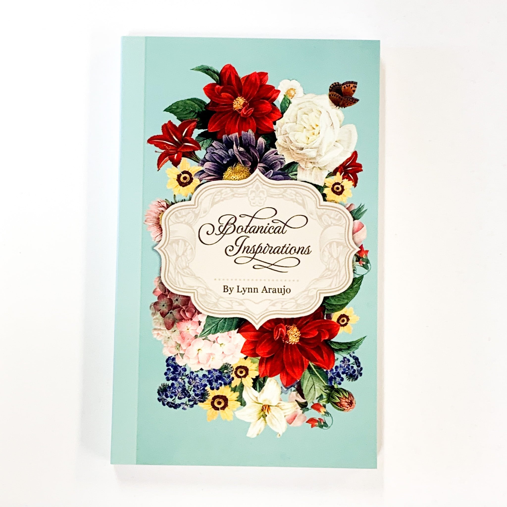 Book cover with floral design and 'Botanical Inspirations' text on a light blue background