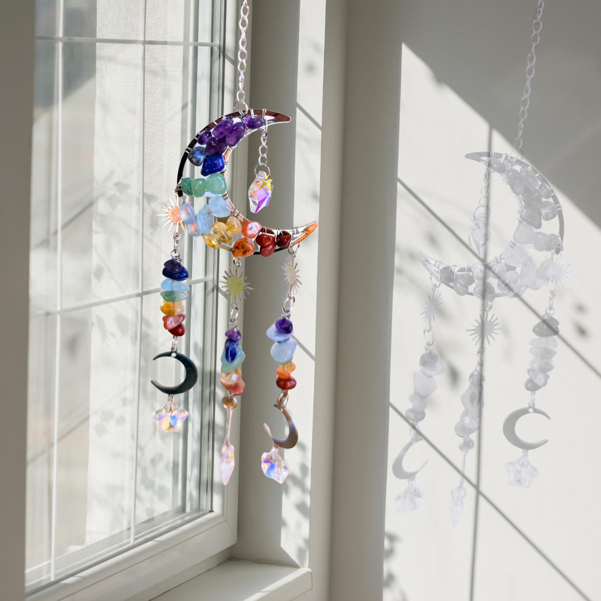 Crescent Moon Chakra Chip Suncatcher Hanging in a window
