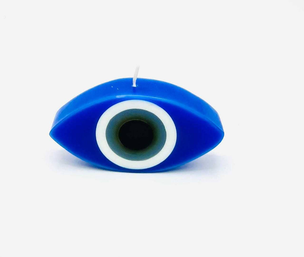 Blue eye-shaped candle on a white background