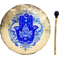 A circular Hamsa hand drum with a blue and white Hamsa design on a beige drumhead, shown next to a wooden mace head on a white background.