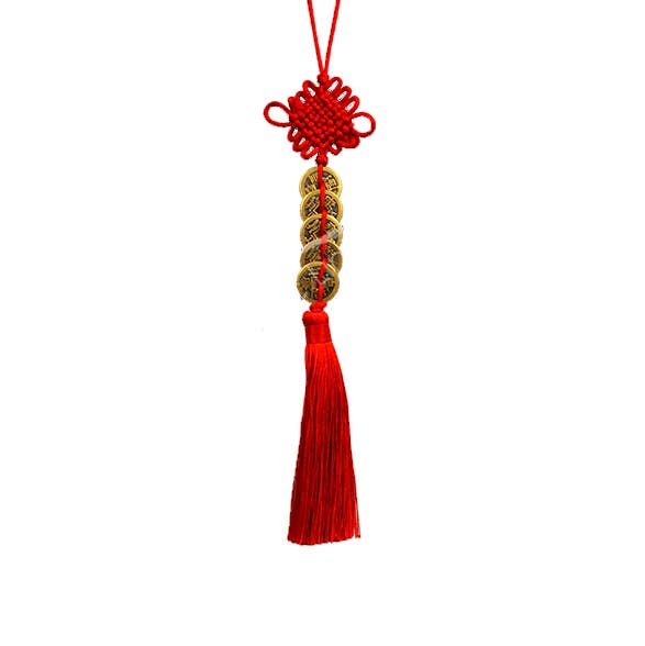 A red Chinese knot hanging ornament with a red tassel and a central decorative cylindrical section featuring gold and red Chinese characters, isolated on a white background.