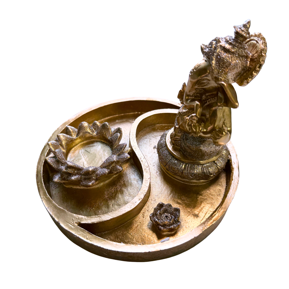 Side view of the gold-colored, sparkly Ganesha Yin-Yang Tealight and Incense Holder on a white background.