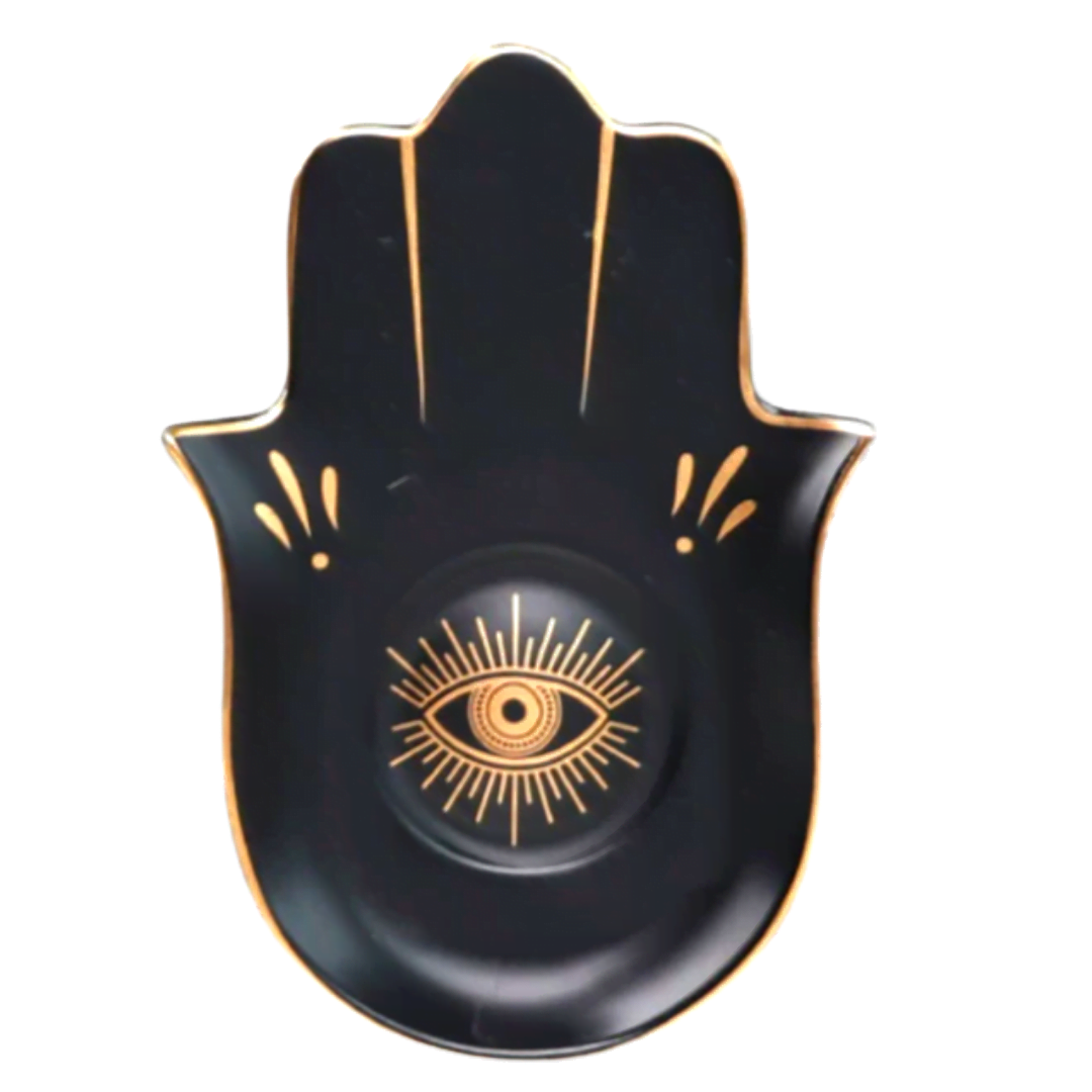 Black Hamsa hand with gold eye design on a white background