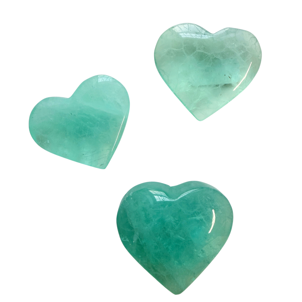 three Lake Green Fluorite Hearts on a white background