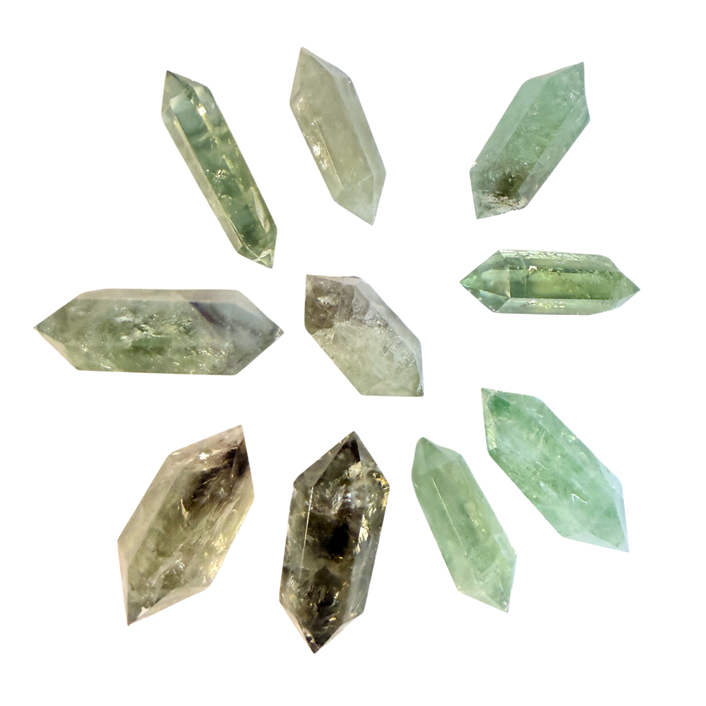 Ten Prasiolite Green Amethyst Double Terminated Points of varying shades of green on a white background