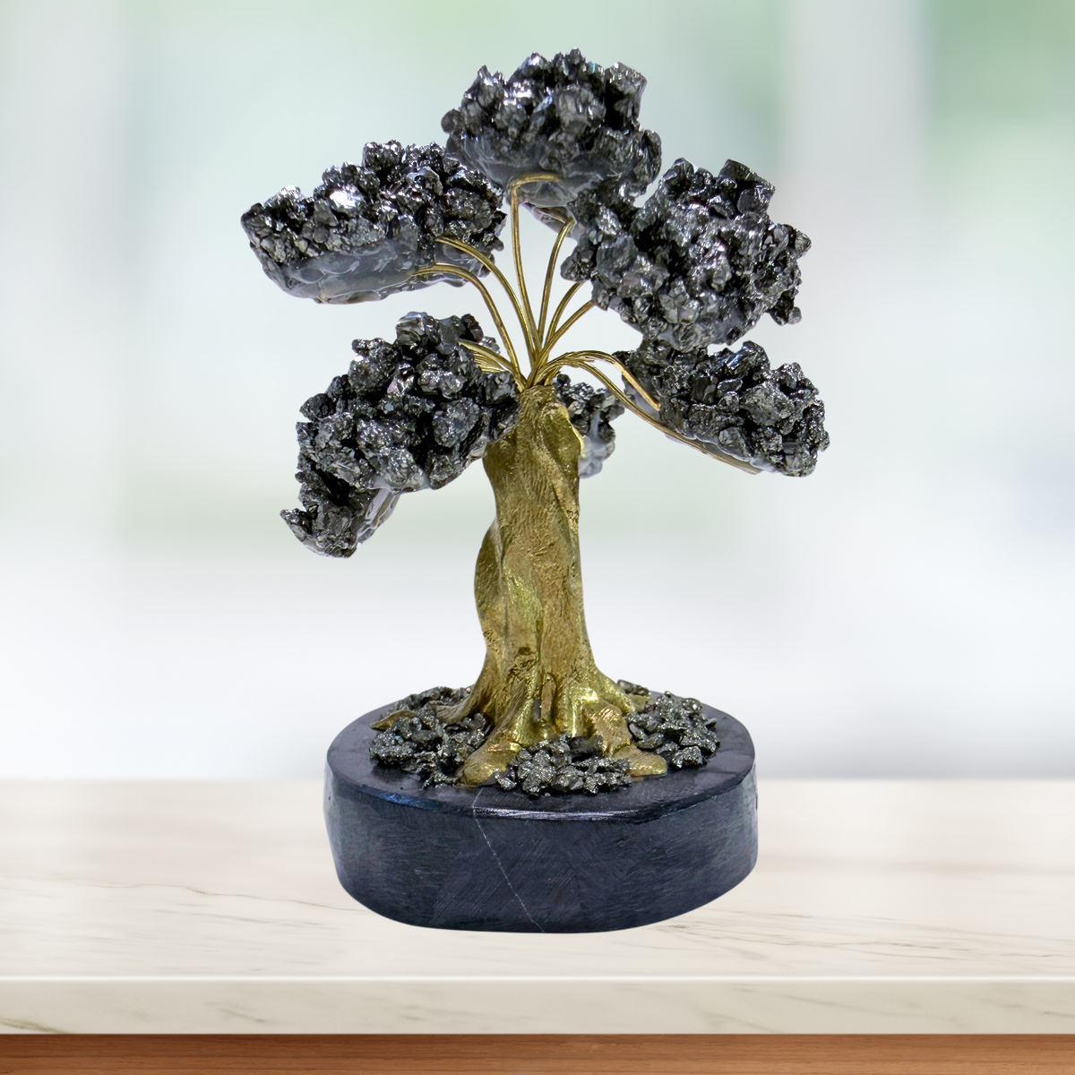 Pyrite Tree on a Black Onyx Base in a windowsill