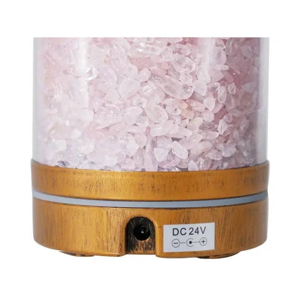 Rose Quartz Essential Oil Diffuser with wooden base and pink rose quartz crystals on a white background