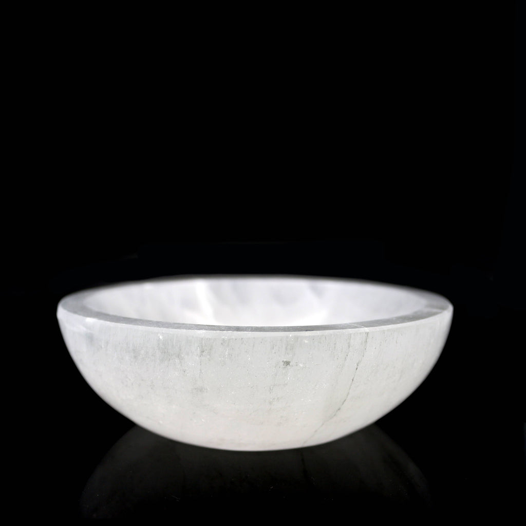 Selenite 6 inch bowl against a black background