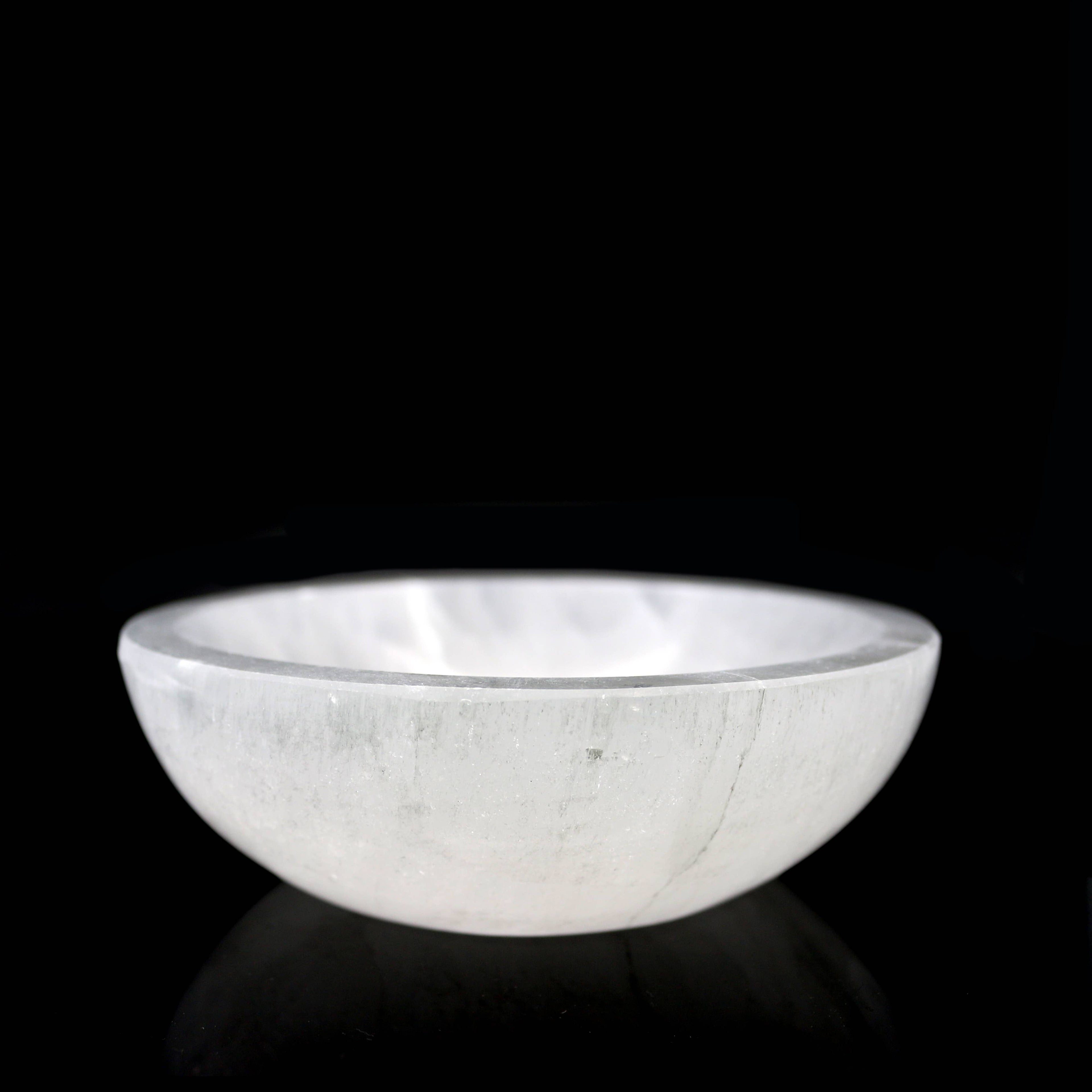Selenite 6 inch bowl against a black background