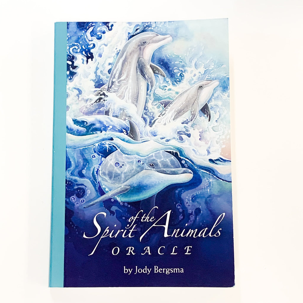 Book cover of 'Spirit Animals Oracle' with dolphins in water design