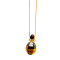 A gold chain necklace featuring a teardrop-shaped pendant made of polished tiger's eye, set against a plain white background.