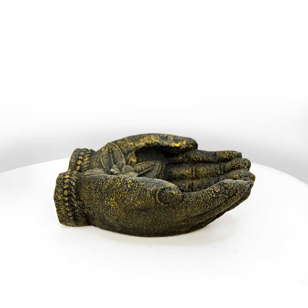 A decorative sculptural hand sculpture in a textured dark green and gold finish, displayed on a white surface against a white background.