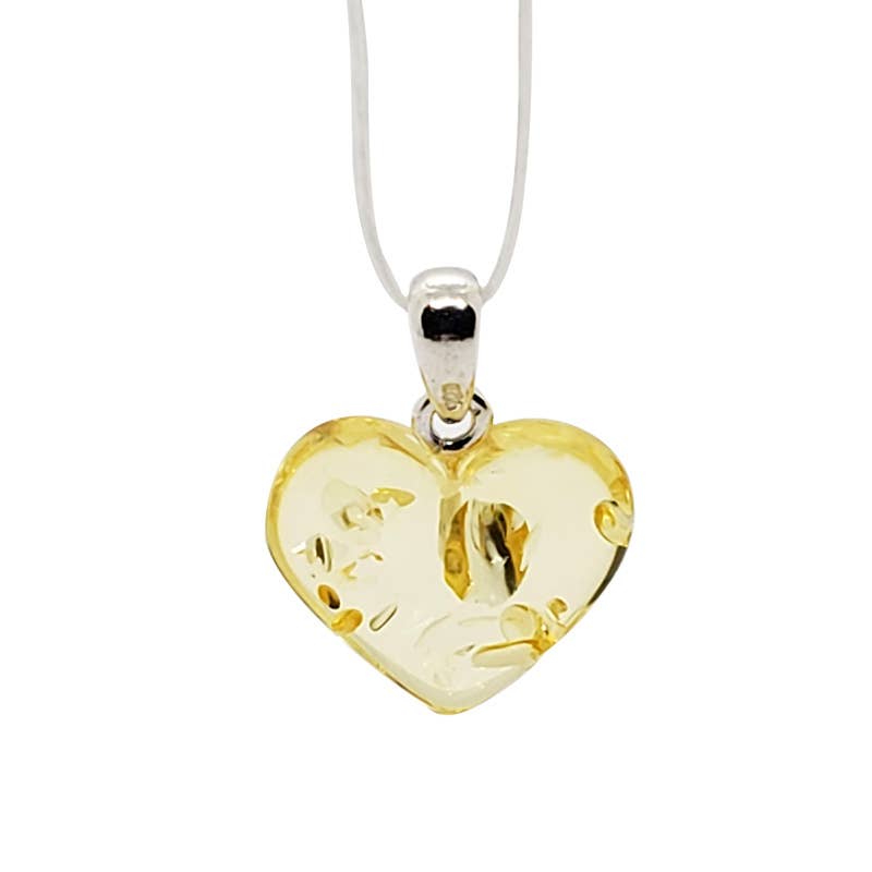 A heart-shaped Amber pendant necklace with a silver bail and a white cord, shown against a plain white background.