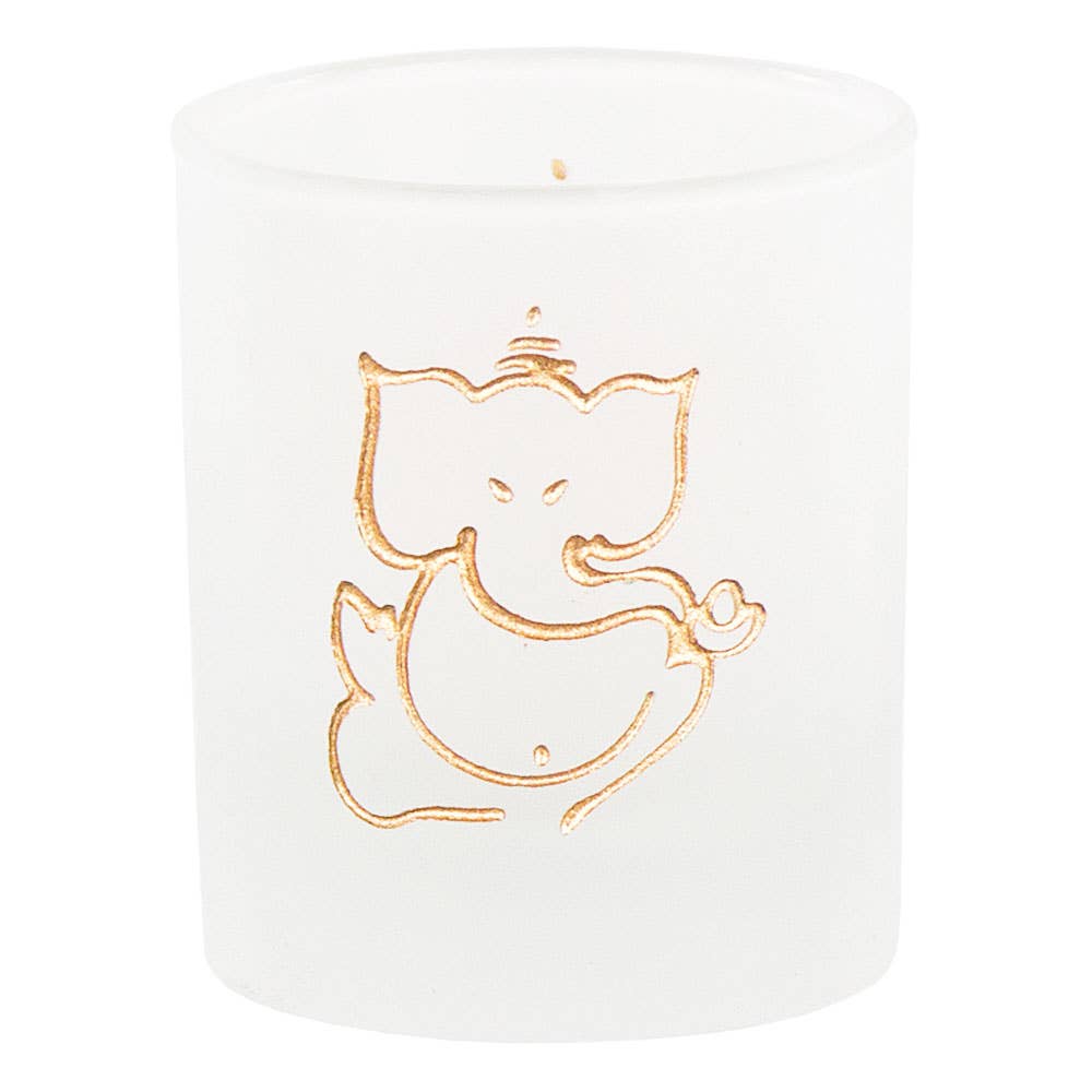White candle with gold cat illustration on a white background