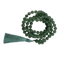 A green aventurine beaded necklace with a matching green tassel,
