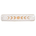 Decorative rolling pin with moon phases on a white background