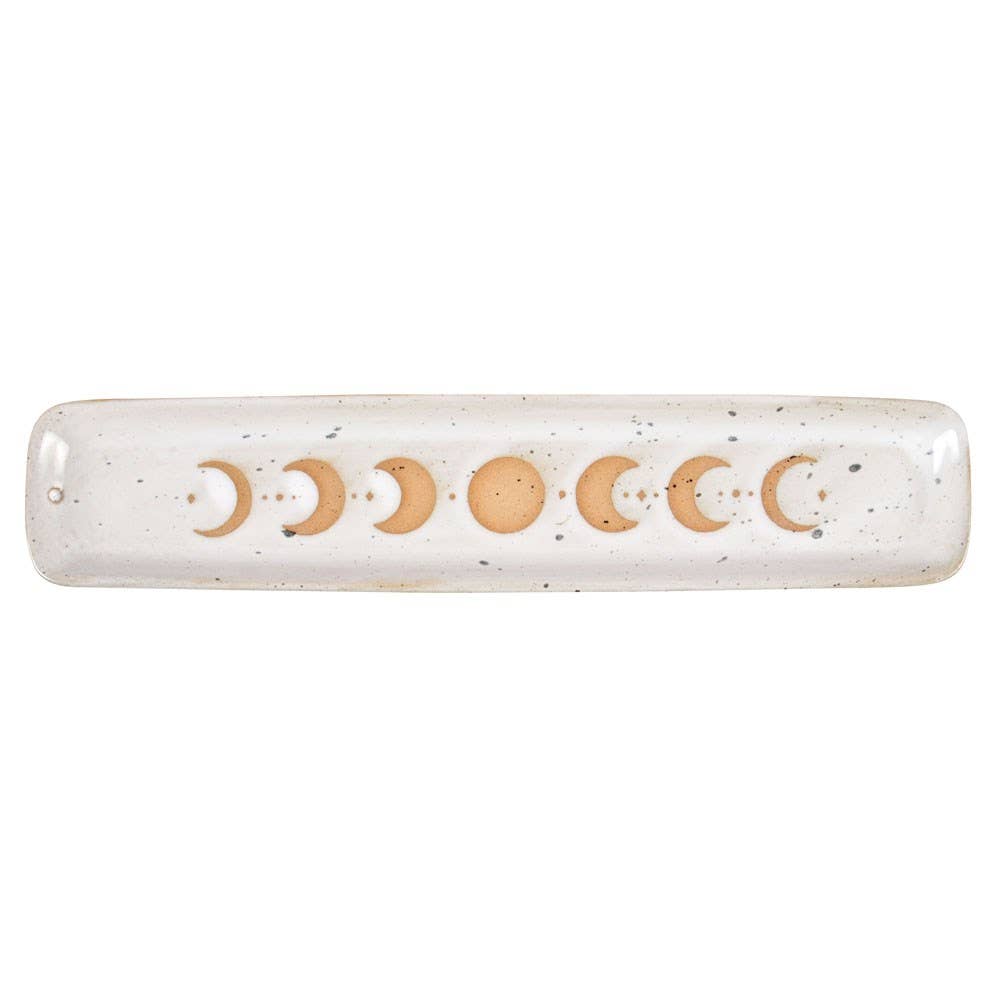 Decorative rolling pin with moon phases on a white background