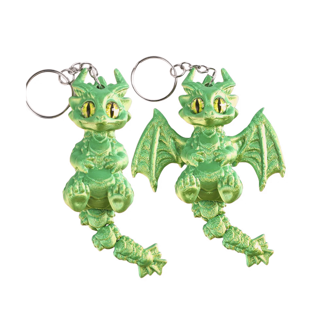 Two green dragon keychains with silver metal key rings, shown against a plain white background.