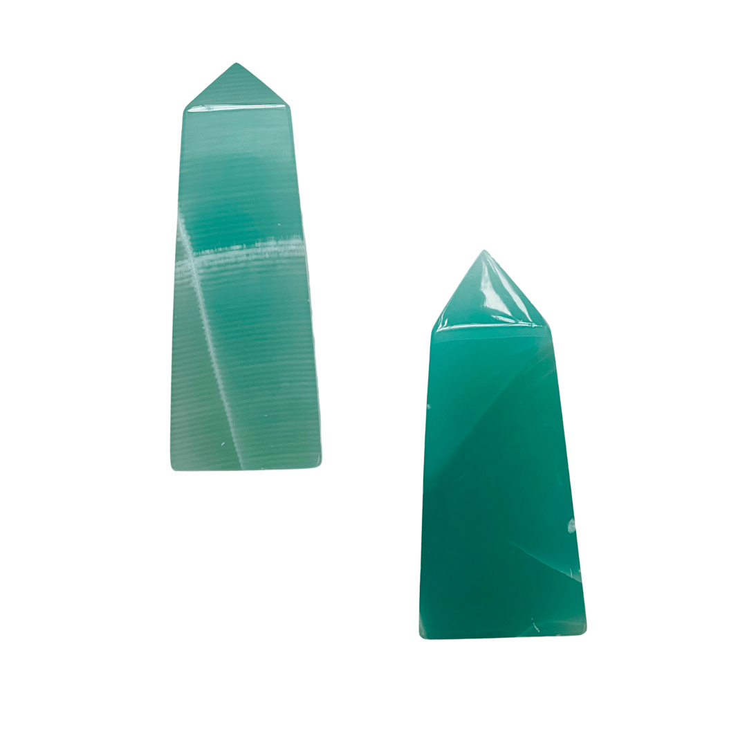 Two green crystal obelisks on a white background