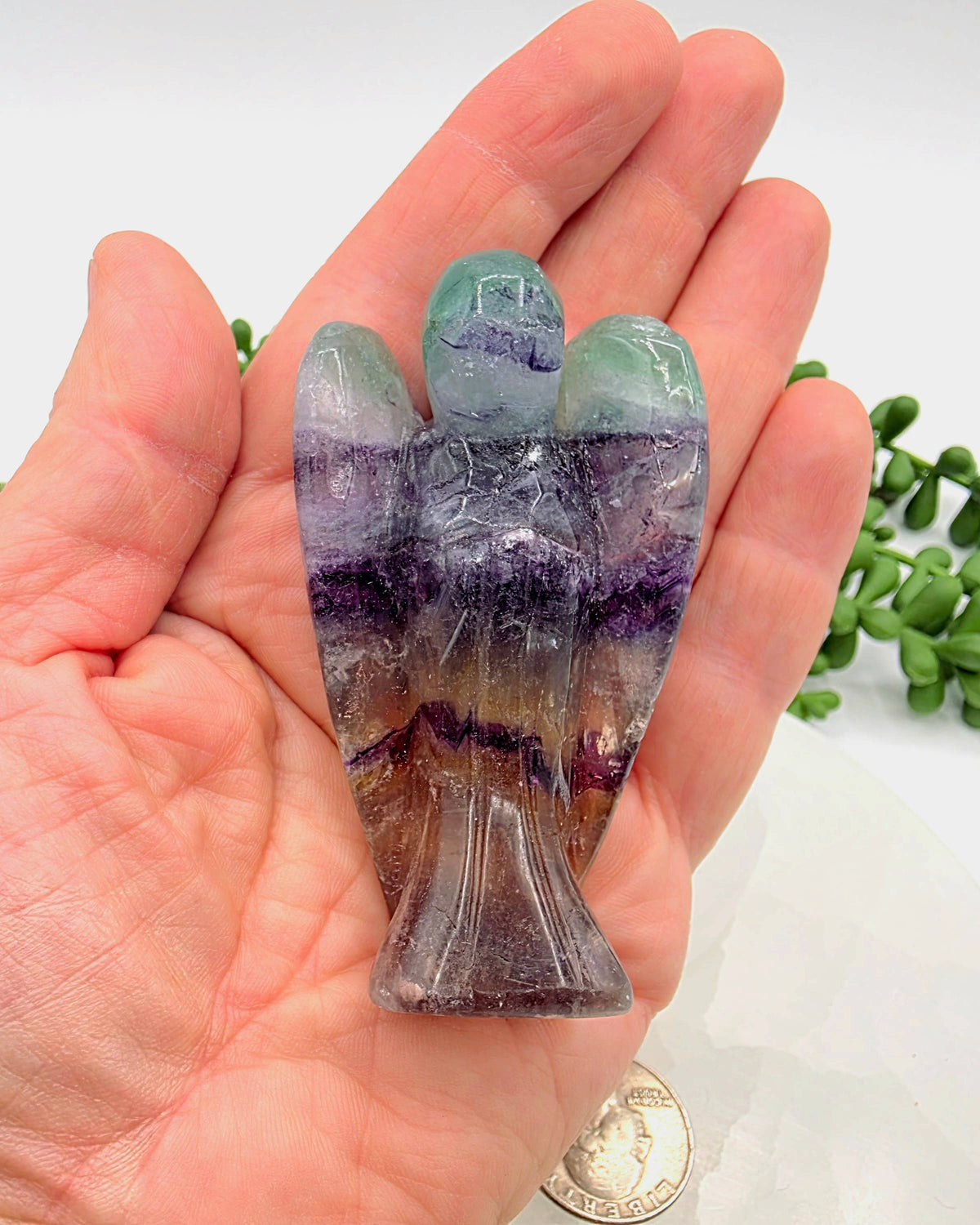 Rainbow Fluorite Angel 3 inches in a hand