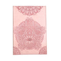 A pink notebook or journal cover featuring an embossed Hamsa hand design with an eye of providence in the center and ornate mandala patterns at the top and bottom, shown against a plain white background.