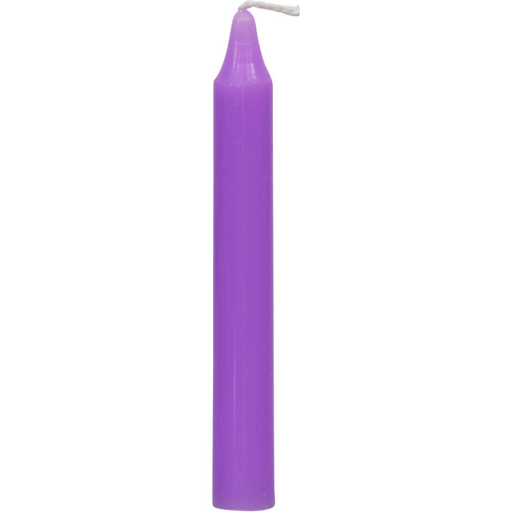 Purple candle on a white background