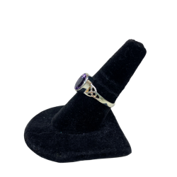 Side view of amethyst celtic ring on stand